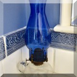 G13. Oil lamp with cobalt glass shade.
